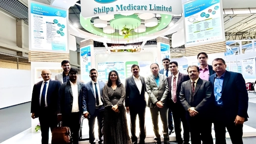 The Shilpa Medicare Limited exhibition stand with green and white branding at a pharmaceutical trade show